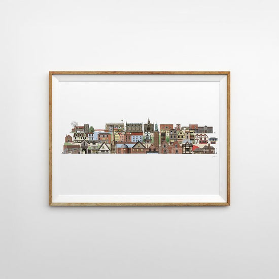 Illustrated print of iconic famous Norwich architecture in various colours in a linear line on a white background. The print is framed horizontally with a thin light wooden frame on a light grey background