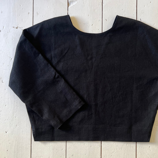 black reversible top on a white floor