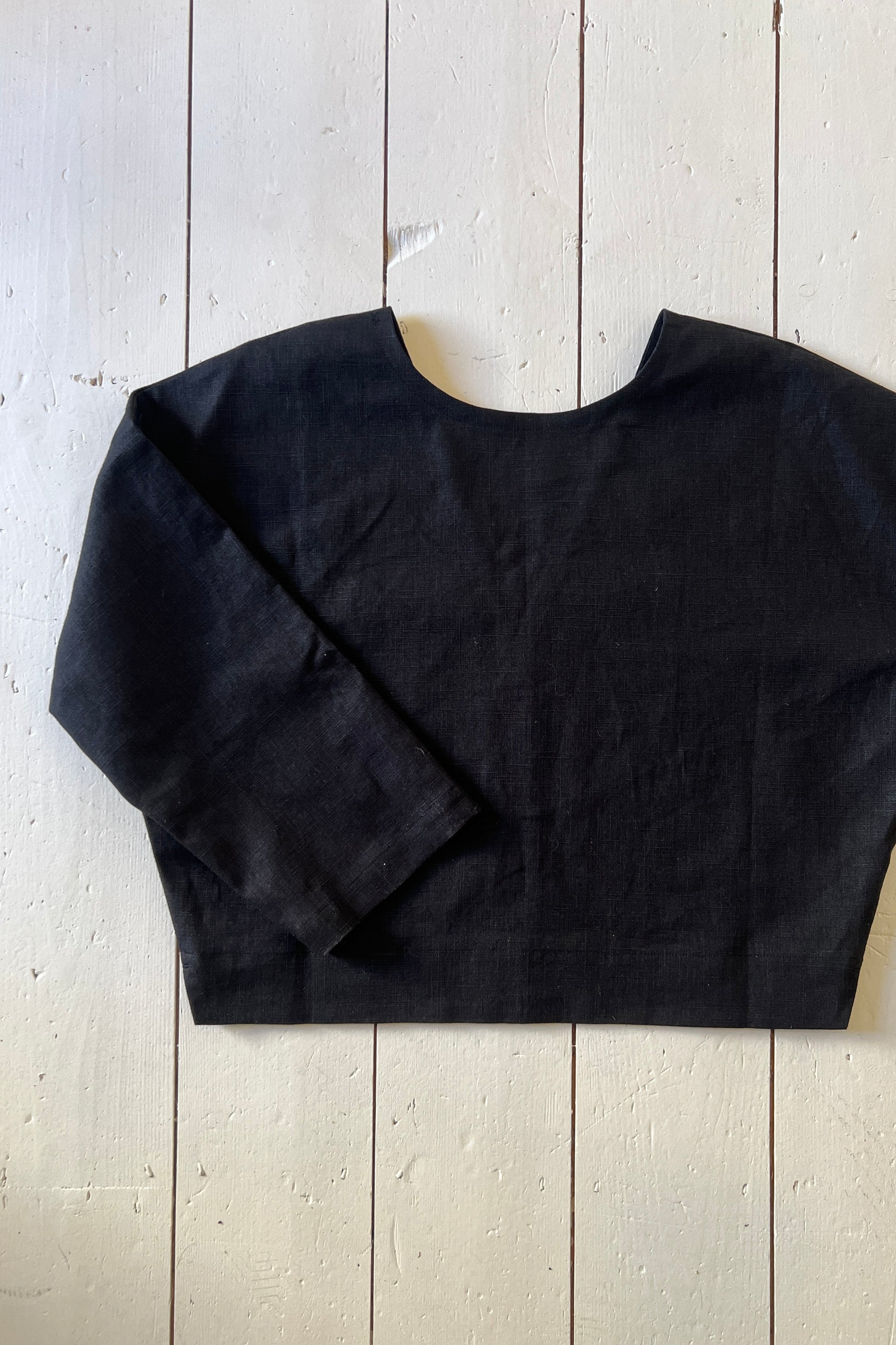 black reversible top on a white floor