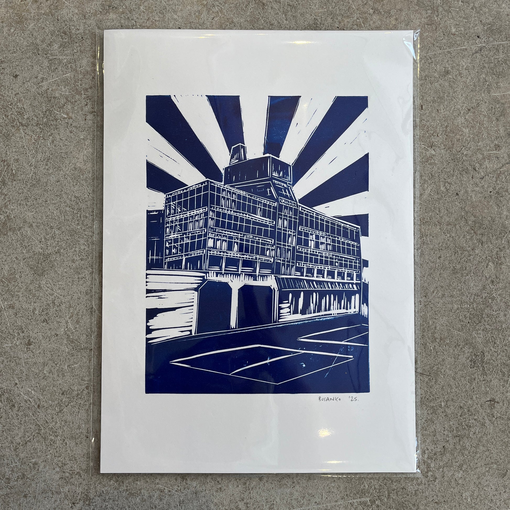 Art print of a building with blue and white design on a gray surface