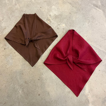 Brown and red neckerchief scarves on a concrete background