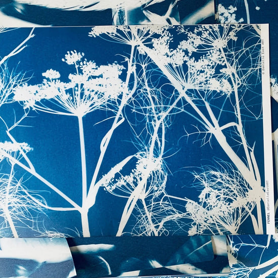 Blue fabric with white floral pattern, displayed on a flat surface.