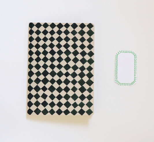 black and white checkered sketchbook on a white background