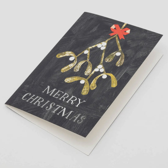 Christmas card with gold mistletoe and red bow on a black background with 'Merry Christmas' text.