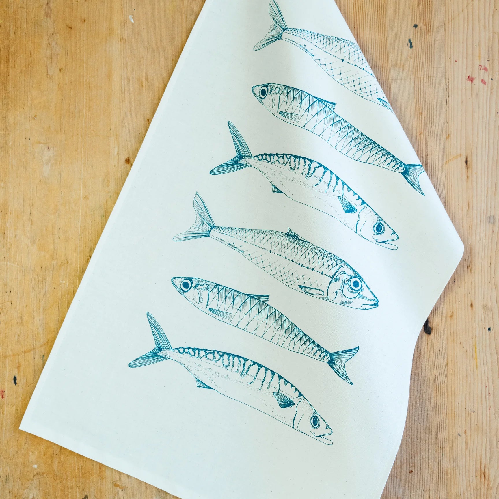 Lottie Day Fish Illustrated Tea Towel On A Wooden Background