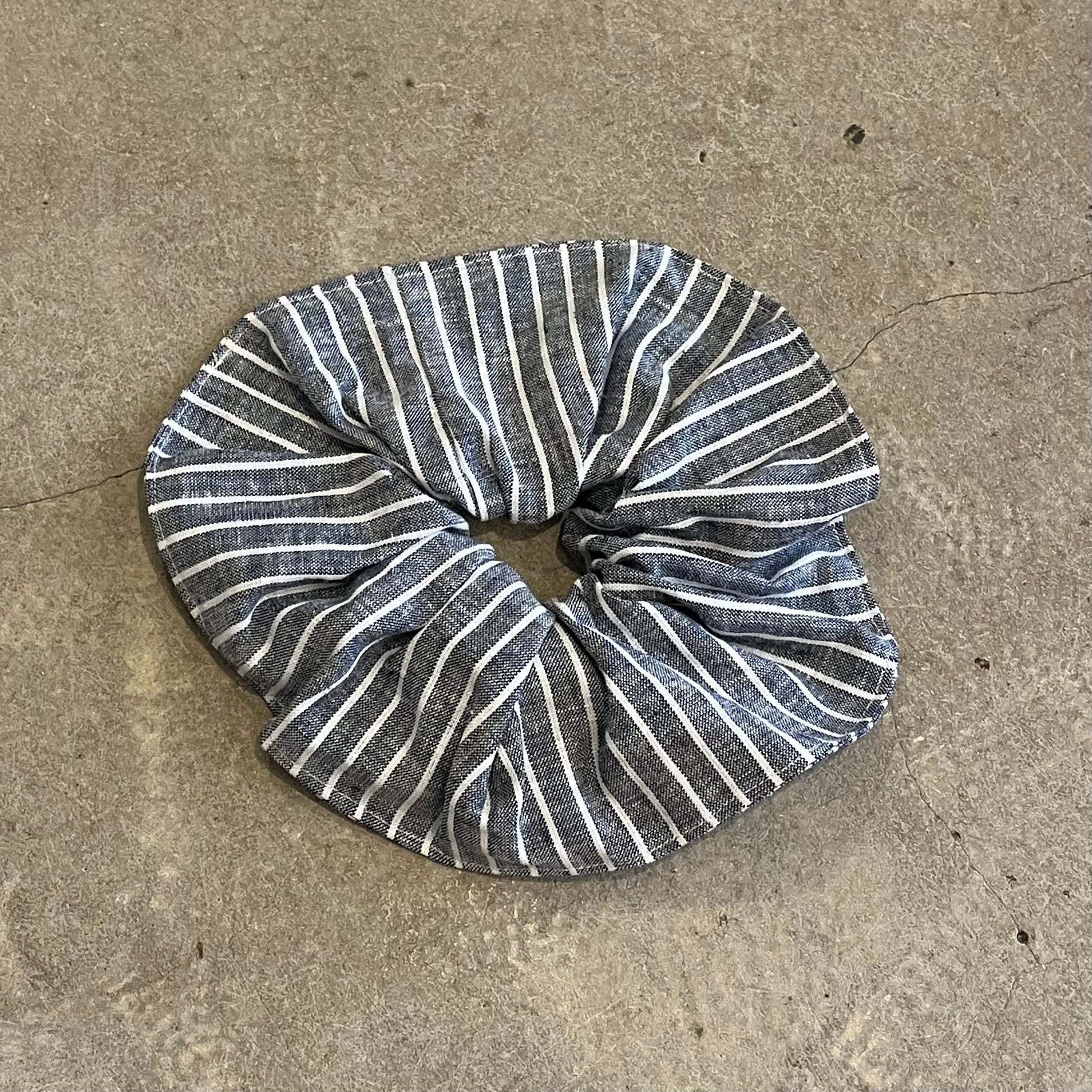 Striped scrunchie on a concrete surface