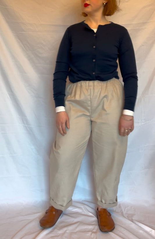 woman wearing a beige pair of trousers