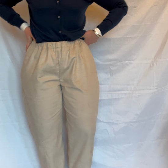 woman wearing a pair of beige cotton cord trousers