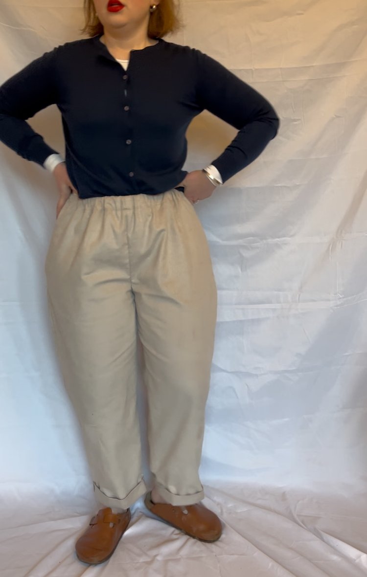 woman wearing a pair of beige cotton cord trousers