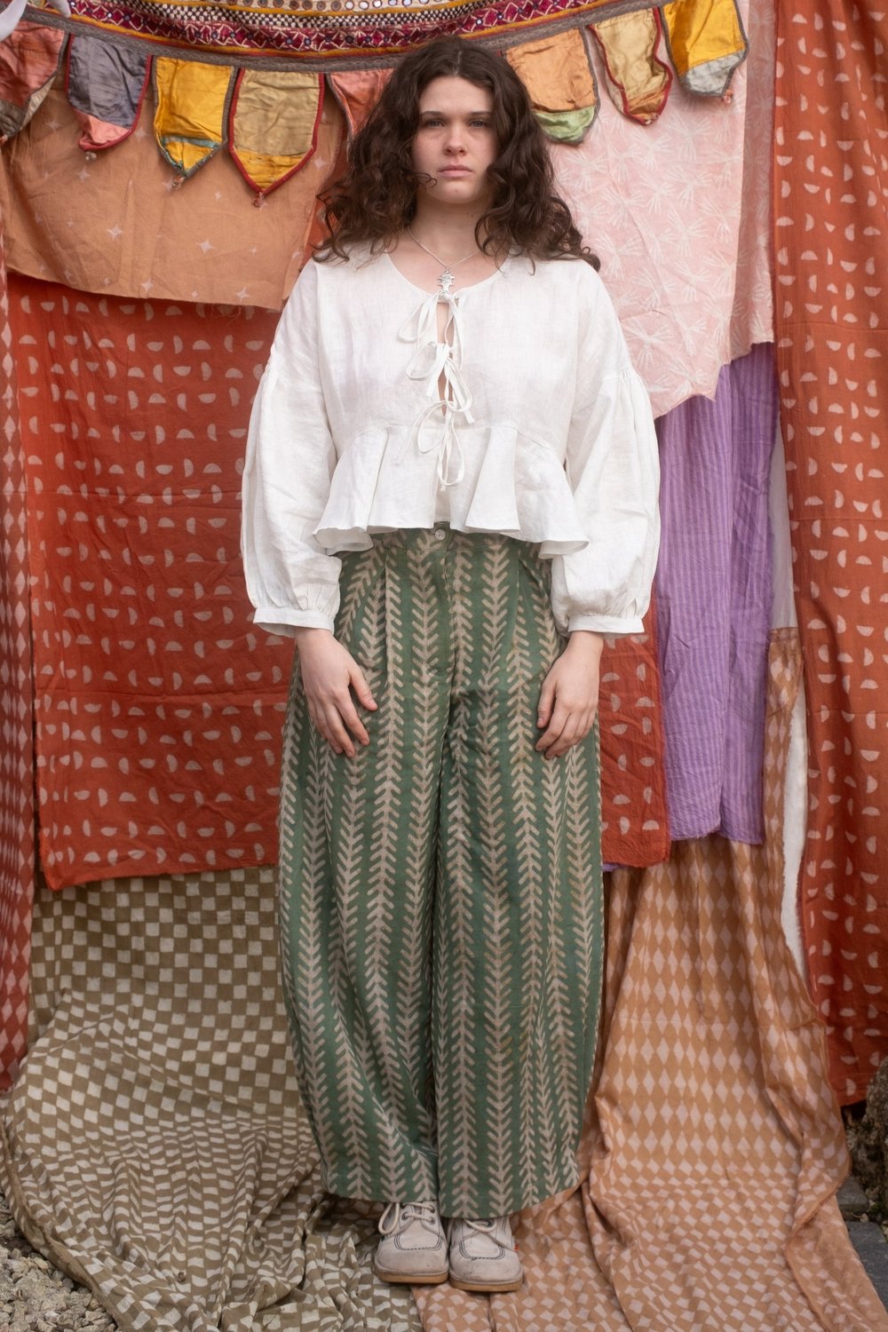 woman wearing the holiday jeans in aloe