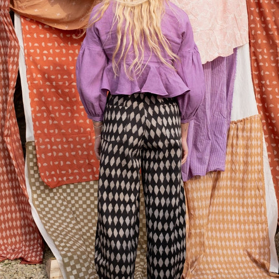 woman wearing holiday jeans in black iron diamond