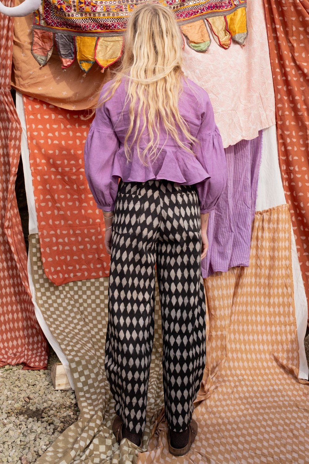 woman wearing holiday jeans in black iron diamond