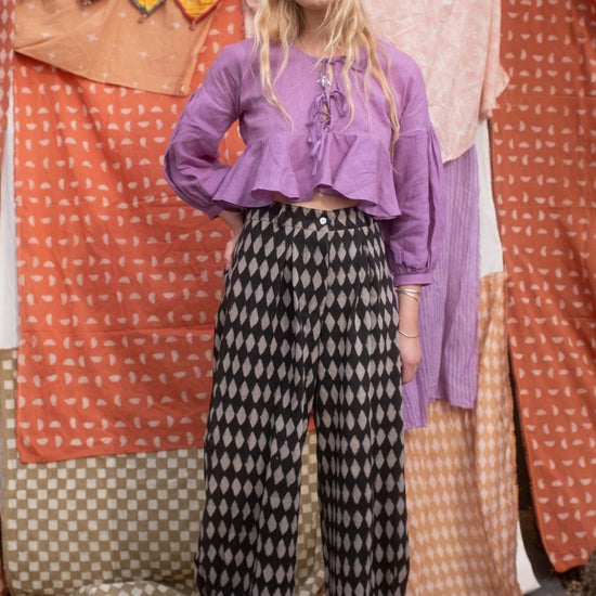 woman wearing black iron holiday jeans