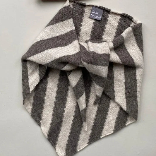 Grey and white striped scarf on a white background