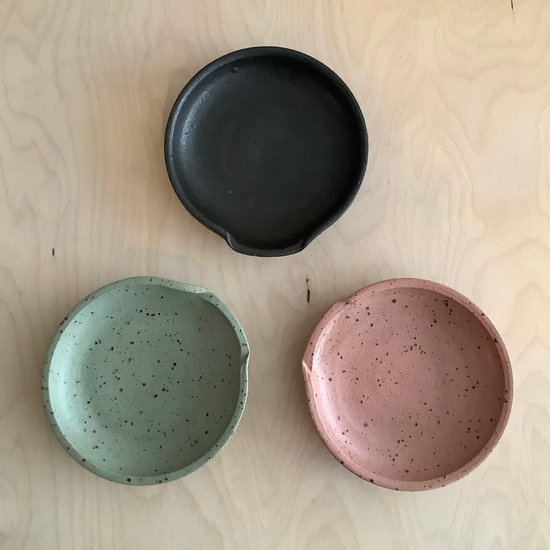 a trio of cermaic spoon rests
