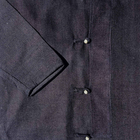 Dark blue jacket with silver buttons