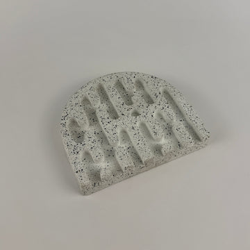 Concrete block with a unique design on a gray background