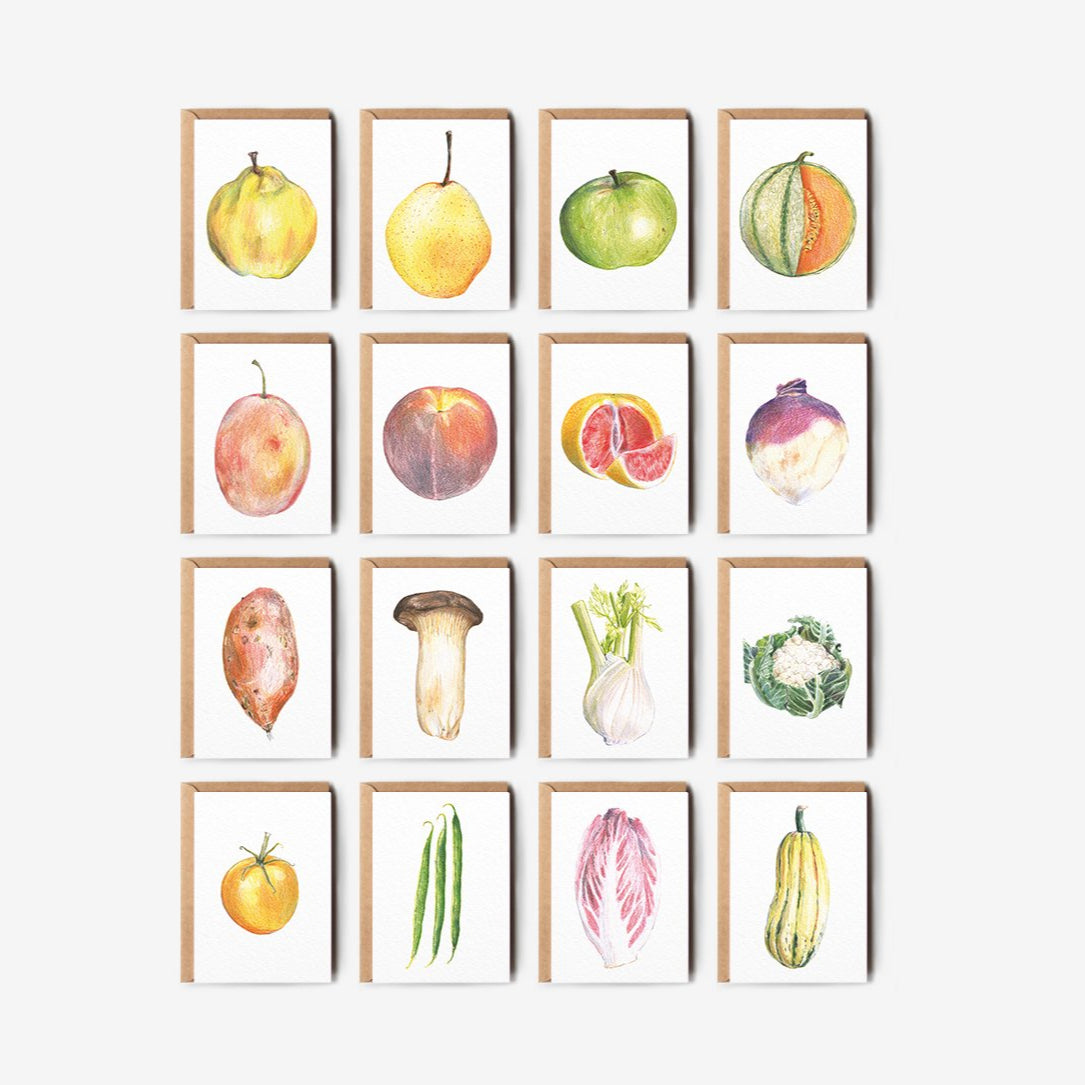Set of illustrated greetings card prints of fruits and vegetables on a white wall