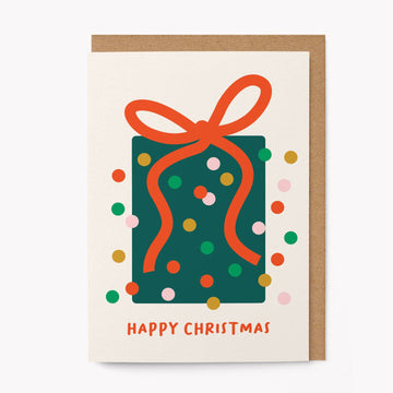 Christmas card with a green present and red ribbon on a white background
