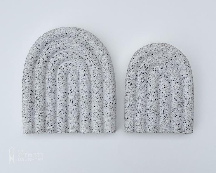 Curved modern soap dish with a smooth, minimalist arc design