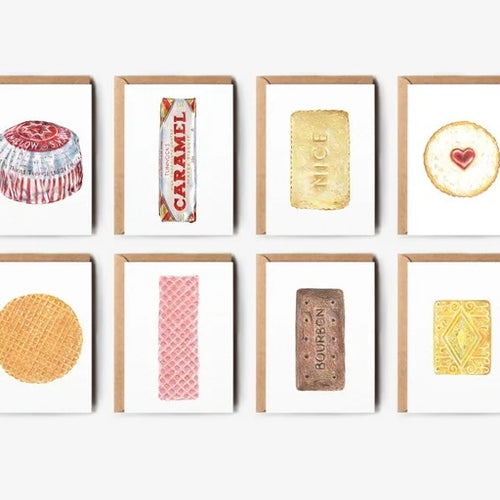 8 single greetings cards with white background featuring different iconic British biscuits including Tunnocks Tea Cake, Caramel, Nice, Bourbon, Custard Cream and a Pink Waffer. The cards have brown envelopes behind them on a pale grey background