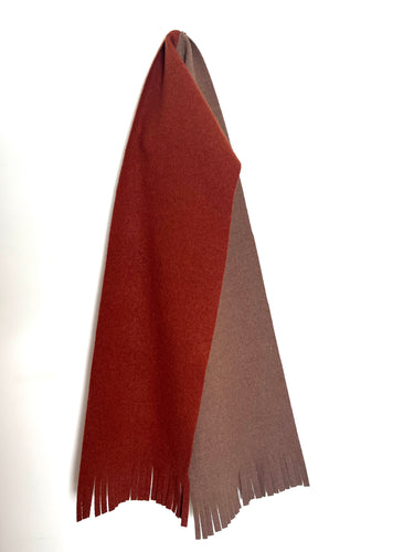 Wool two tone rust and brown coloured scarf on a white background