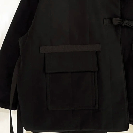 Black coat with a pocket on a white background