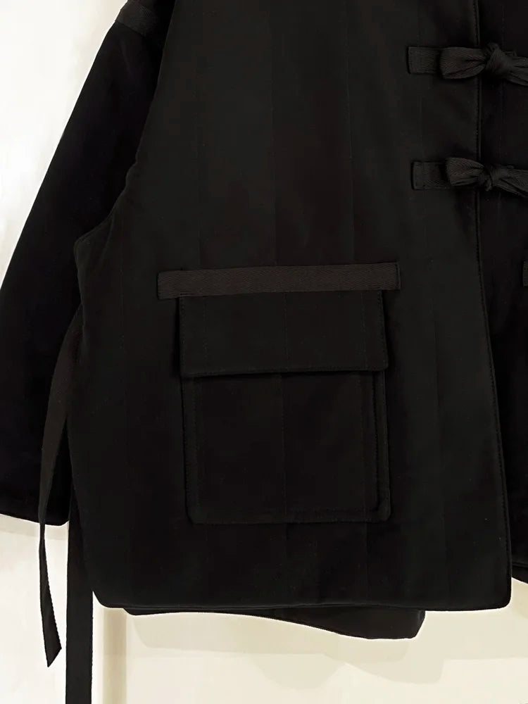 Black coat with a pocket on a white background
