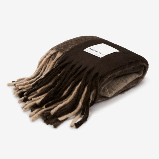 A brown throw on a white background 