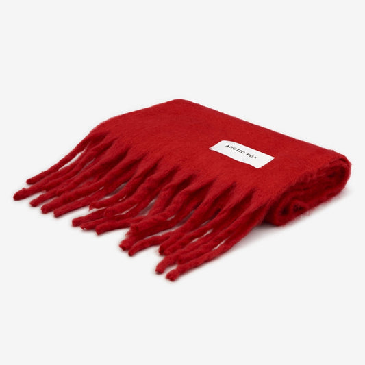 Red scarf with fringes on a white background