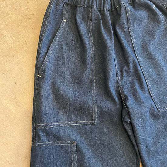 Blue jeans on a beige background