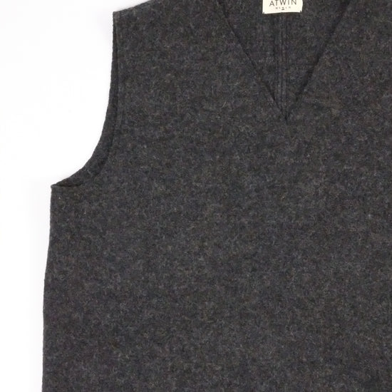 Dark gray vest on a white background