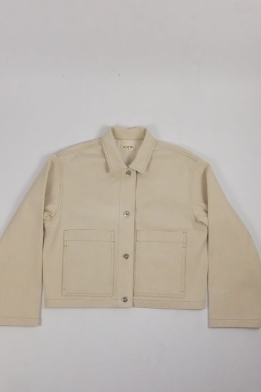 beige denim jacket on a white background 