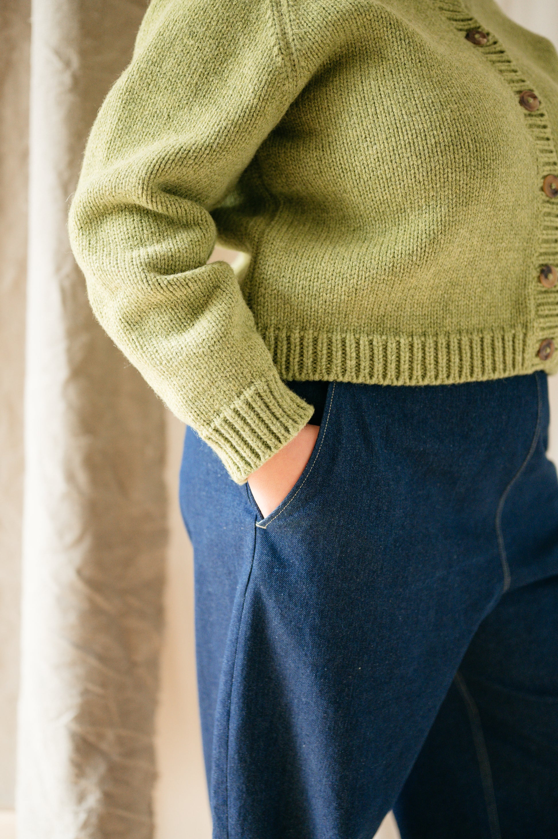 Close-up of curved leg silhouette and pockets