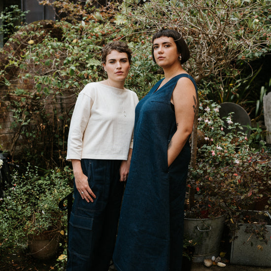 2 women wearing atwin the label outfits standing in a garden