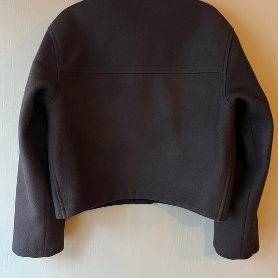 Dark brown wool cropped jacket with collar back view on a light grey background