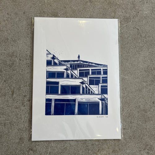 Blueprints of a building on a gray surface