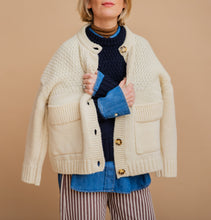 Load image into Gallery viewer, Woman wearing white cardigan on a peach backgorund 
