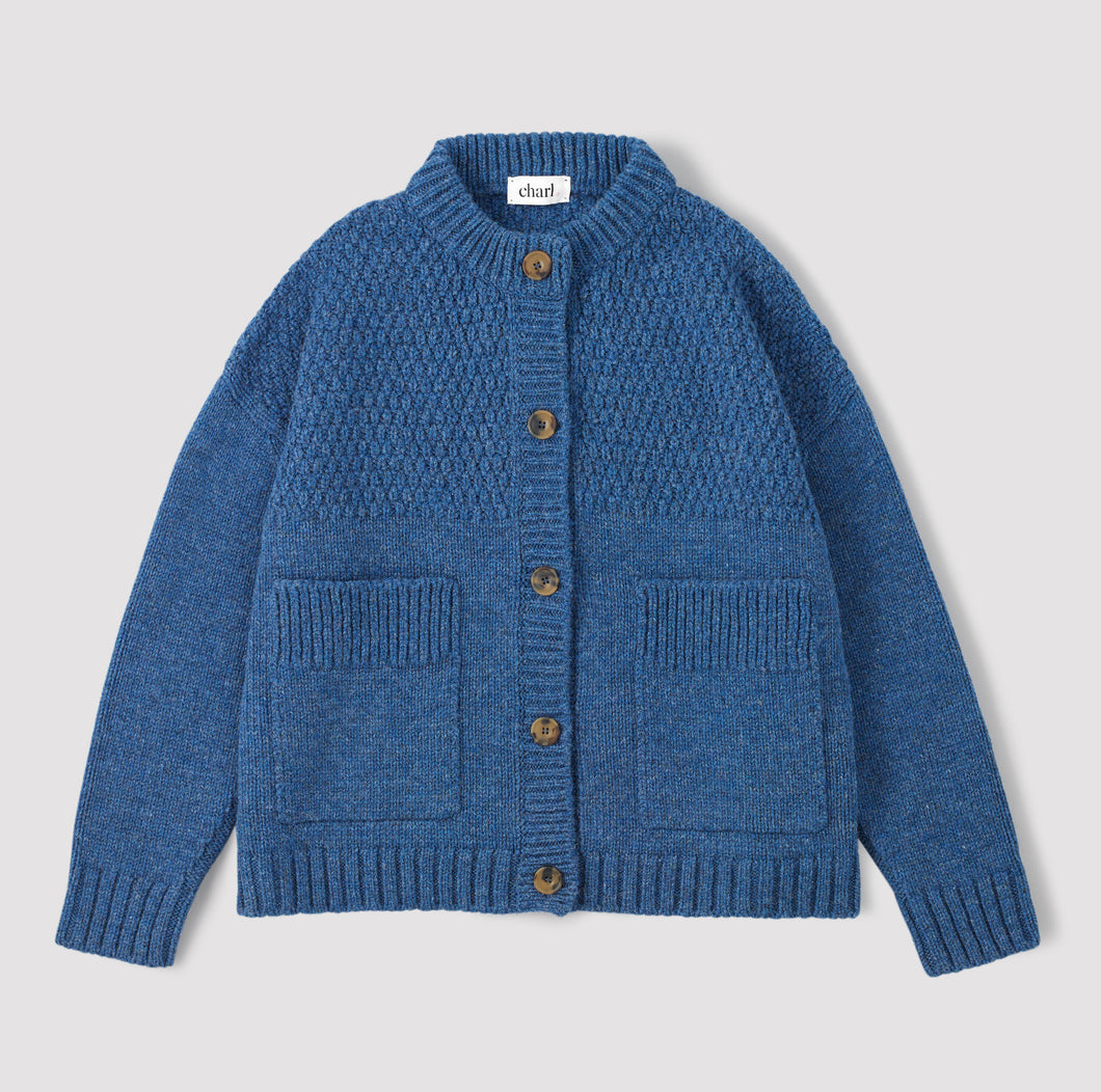 Blue cardigan on a white background 