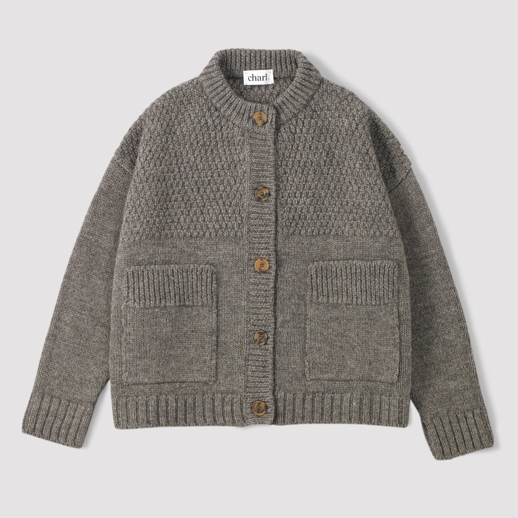 Grey knitten british wool cardigan on a white background