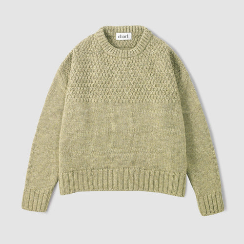Green jumper on a white background 