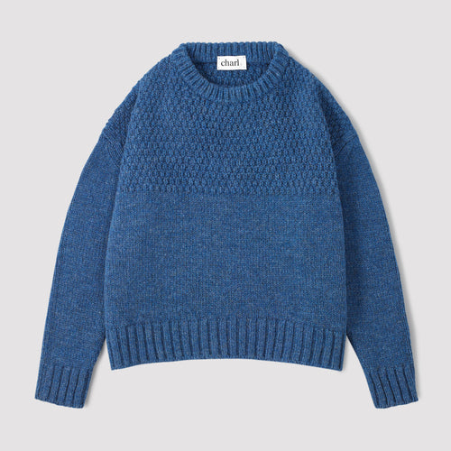 Blue wool jumper on a white background 