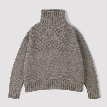 Grey funnel neck knitted sweater on a light grey background