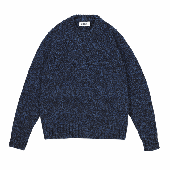 Blue knitted sweater with a brand label on a white background