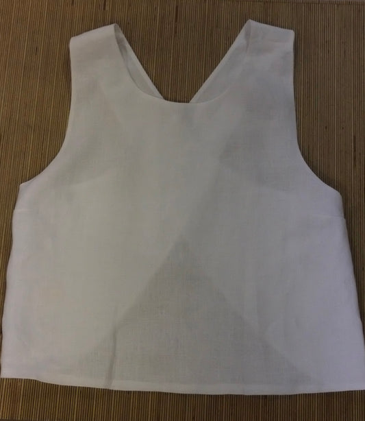 A white sleeveless crop top with a wide scoop neckline, laid flat on a brown woven mat background.