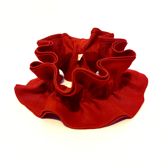 Scarlet red ruffle pie crust collar on a white background