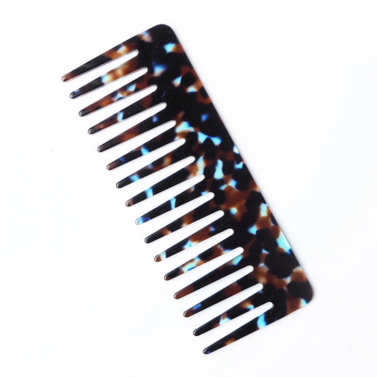 Tortoiseshell-patterned comb on a white background