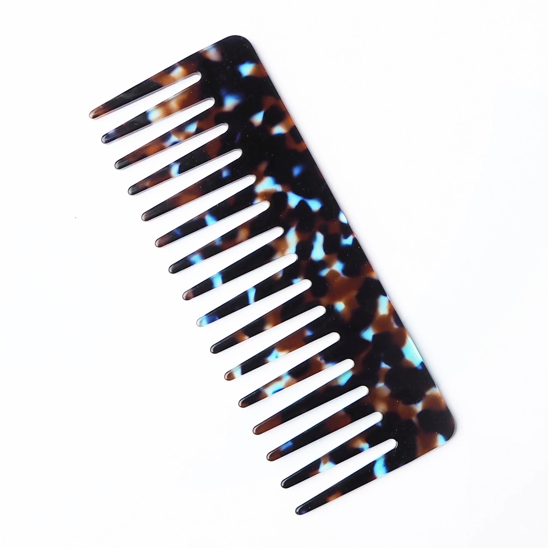 Tortoiseshell-patterned comb on a white background