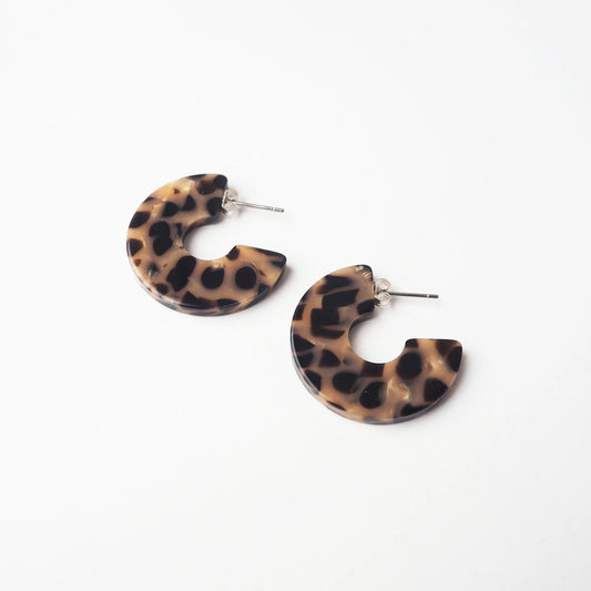 Tortoiseshell print hoop earrings on a white backgRound