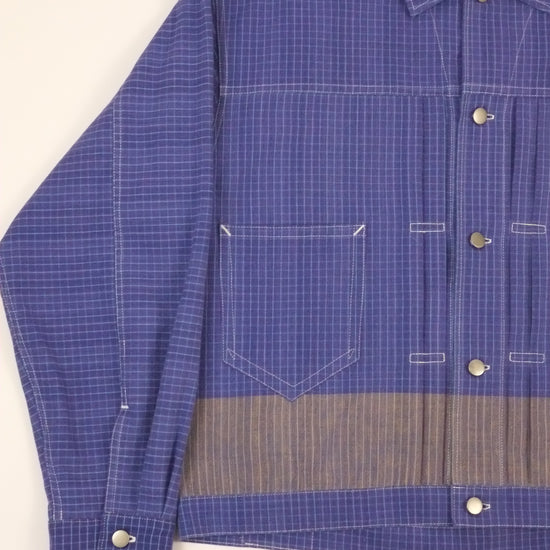 Blue checkered shirt with gray interior on a white background